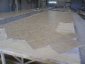 Belmont paint plant: tile floors being assembled (SOC)